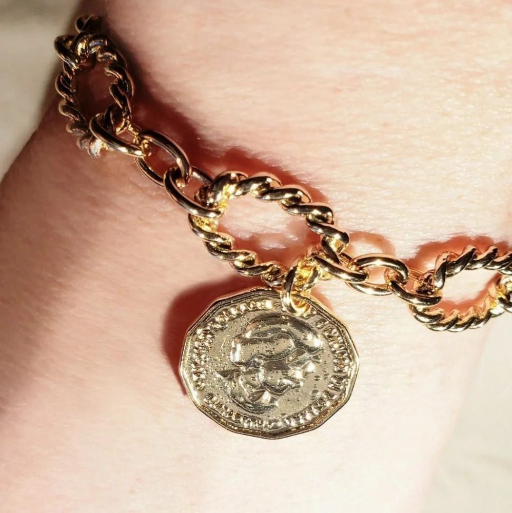 Copper twisted bracelet w/2 sided charm; NWOT